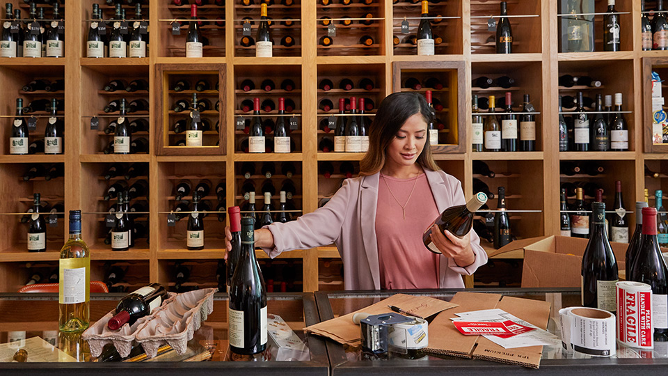 Woman shipping wine with UPS