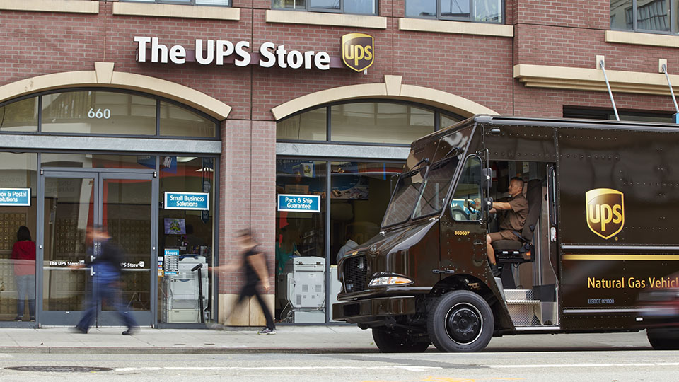 UPS driver dropping off package
